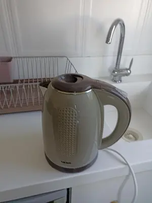 a tea kettle sitting on a kitchen counter at Studios Staring at the Sunset in Chania Town