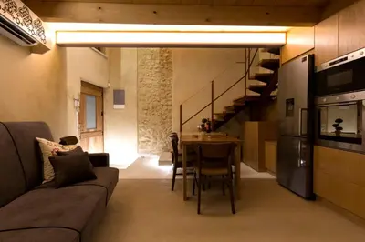 a living room with a couch and a table at Evans House II in Chania Town