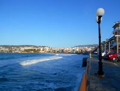 a street light next to a body of water at Evans House II in Chania Town