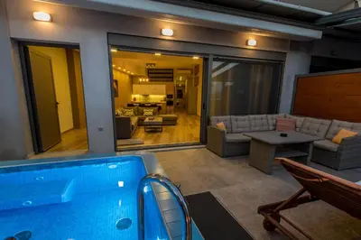 a swimming pool in a room with a living room at UTOPIA luxury apartment in Chania Town