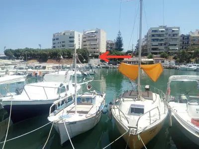 a group of boats are docked in a harbor at UTOPIA luxury apartment in Chania Town