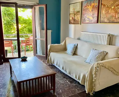 a living room with a couch and a coffee table at Art Home in Chania Town