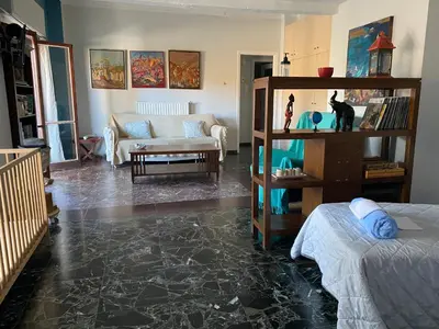 a living room with a couch and a table at Art Home in Chania Town