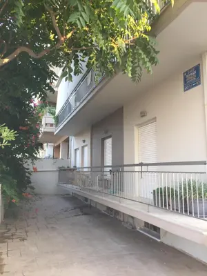 a building with a balcony on the side of it at Art Home in Chania Town