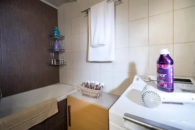 a bathroom with a purple bottle on a sink at Rafalia Cozy Apartment in Chania Town