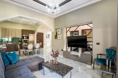 a living room with a couch and a table at Elegant 2BR Apartment in Chania Town