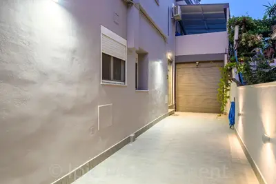 a hallway of a house with a garage at Elegant 2BR Apartment in Chania Town