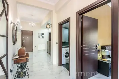 a door to a laundry room with a washing machine at Elegant 2BR Apartment in Chania Town