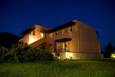 a house at night with the lights on at Kallicrates Village in Frangokastello