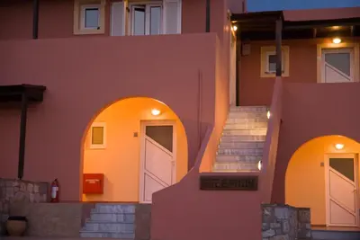a house with two white doors and some stairs at Kallicrates Village in Frangokastello
