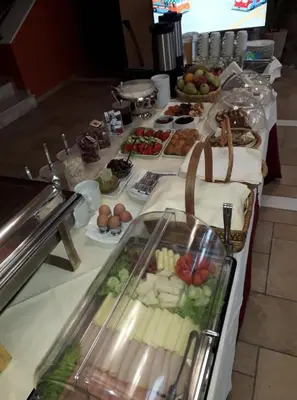 a table with a buffet of food on it at On The Rocks in Palaiochóra
