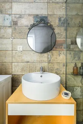 a bathroom with a white sink and a mirror at You and Me -750m from the sea in Kissamos