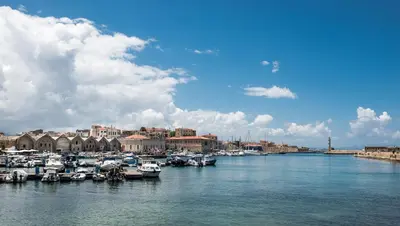 a group of boats docked in a harbor on a river at Villa Anton by Cura Villas Collection in Kalathas