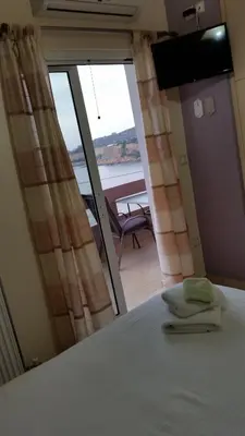 a bedroom with a bed and a view of the ocean at Amazing Sea View Apartment in Chania Town