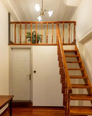 a staircase in a house with a white door at Vilelmine in Chania Town