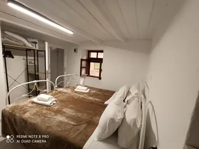 a hospital room with a bed with white pillows at Casa Topane in Chania Town