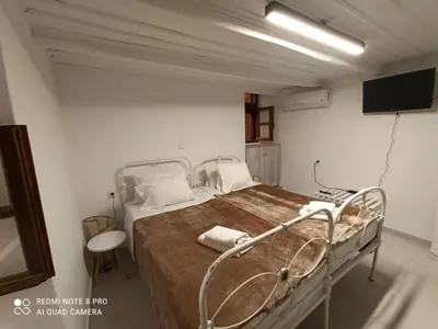 a hospital room with a hospital bed with a tv at Casa Topane in Chania Town