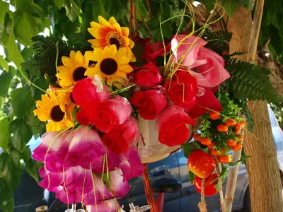 a bunch of flowers hanging from a tree at Villa Rita Apartments A in Tavronitis
