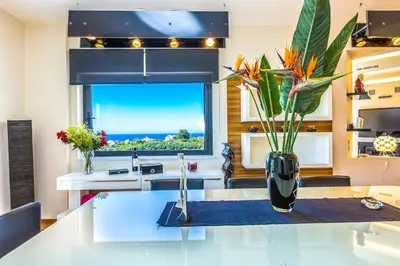 a kitchen with a sink and a vase with flowers on a counter at Villa Veggera Chania in Kondomari