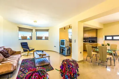 a living room with a couch and a table at Villa Veggera Chania in Kondomari