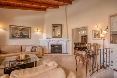 a living room with a couch and a fireplace at Kalliopi's Maisonette in Chania Town