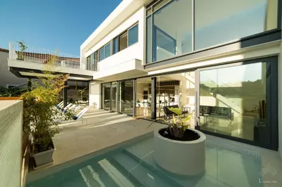 a house with a swimming pool in front of it at Villa L2/ Boutique Villa in Kato Daratso