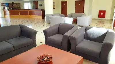 a waiting room with two couches and a table at Sunny Bay Hotel in Kissamos