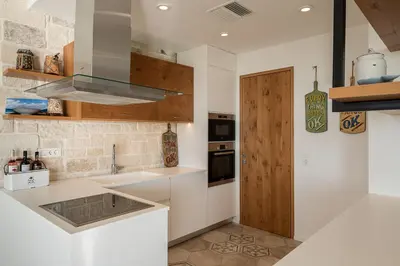 a kitchen with a sink and a counter top at Casa le Cicale in Falasarna