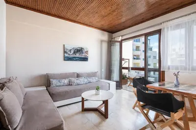 a living room with a couch and a table at Magia Apartments in Chania Town