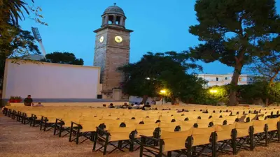 a large amphitheater with a clock tower in the background at Sunhouse-CH in Chania Town