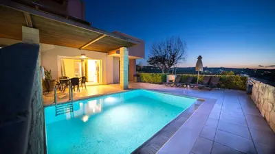 a swimming pool in the backyard of a house at Lofos Village Chania in Agia Marina Nea Kydonias
