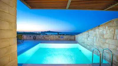 a swimming pool on the roof of a house at Lofos Village Chania in Agia Marina Nea Kydonias