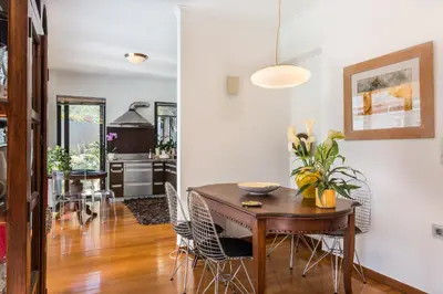 a kitchen and dining room with a table and chairs at Artistic Pool Private Villa in Chania Town