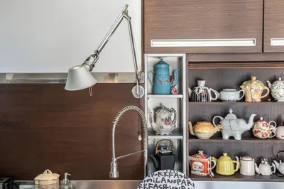 a kitchen counter with a sink and a lot of ceramics at Artistic Pool Private Villa in Chania Town