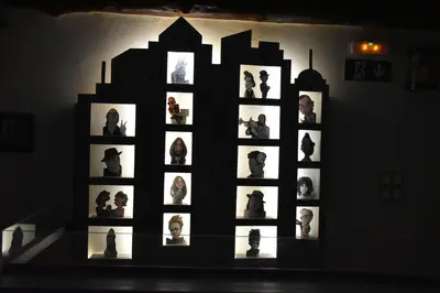 a wall with a display of photographs on a wall at Odos Oneiron Boutique Hotel in Chania Town