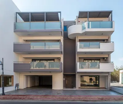 an apartment building with balconies on the side at Jasmine in Maleme