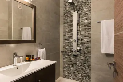 a bathroom with a sink and a shower at Mimosa in Maleme