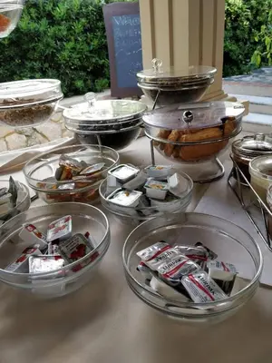 a table topped with bowls of food and other dishes at Alianthos Suites in Tersanas