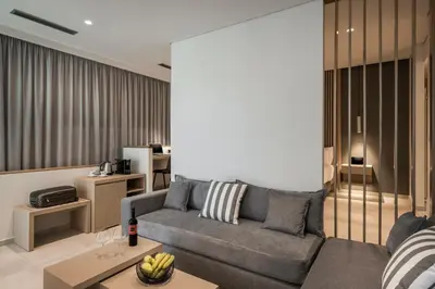 a living room with a couch and a table at Trianon Luxury Apartments & Suites in Chania Town