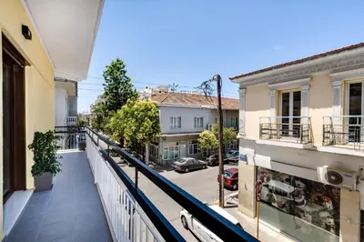 an apartment balcony with a view of a street at City Breeze Apartment in Chania Town