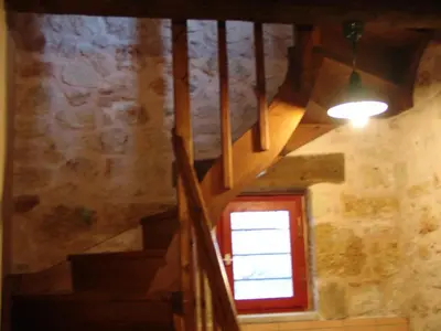 a staircase with a window in a stone building at Fabrica in Vamos