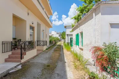 an alley way between two buildings at Rena House in Kissamos