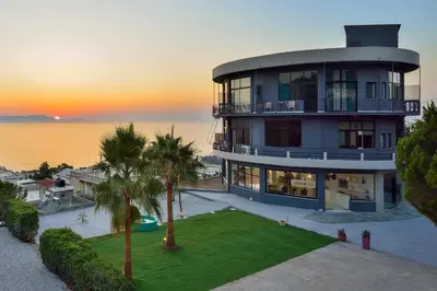 an aerial view of a large house with a yard at Loucerna Suites Chania in Chania Town