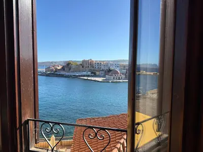 a view of the water from a balcony at Helena Hotel in Chania Town