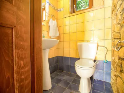 a bathroom with a toilet and a sink at Falasarna Villas in Falasarna