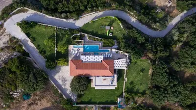 an aerial view of a house with a pool at Villa Elena Chania in Karefilianá