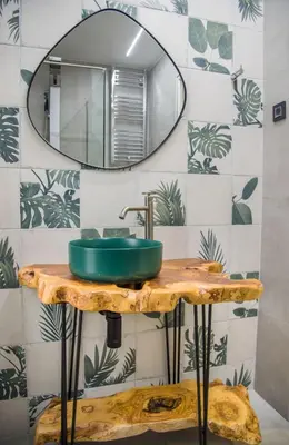 a bathroom with a green sink and a mirror at Villa Alyona in Skinés