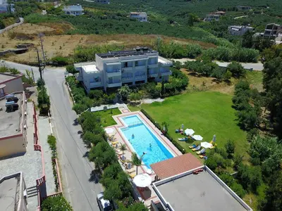 an aerial view of a resort with a swimming pool at Merabello Apartments in Agia Marina Nea Kydonias