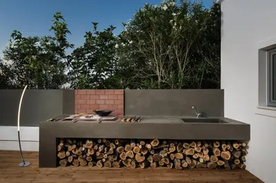 a kitchen with a pile of wood and a sink at Villa Sapphire in Almirida