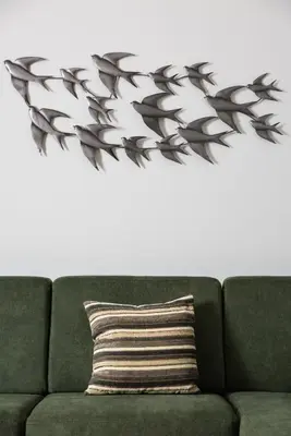 a wall sticker of a tree above a green couch at Dreamy Holidays Apartment in Chania Town